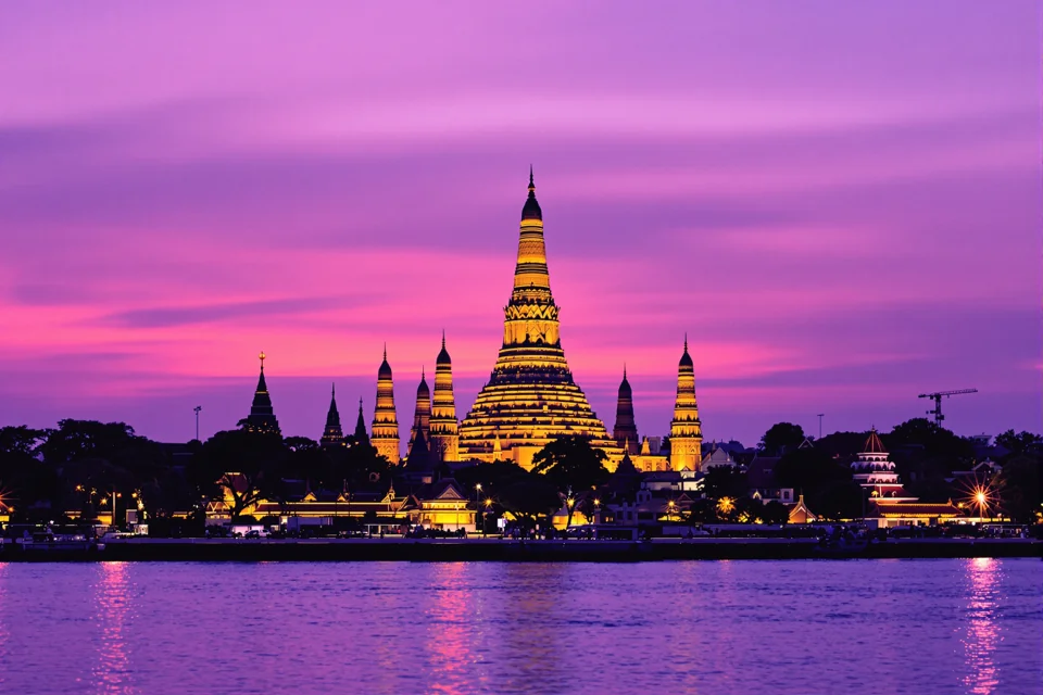 The porcelain-clad central prang of Wat Arun on the Chao Phraya in Bangkok