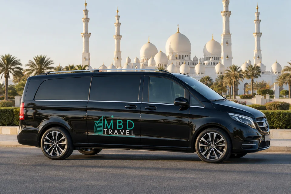 Black Mercedes-Benz Vito with MBD Travel livery with the exterior of Sheikh Zayed Grand Mosque, visualization